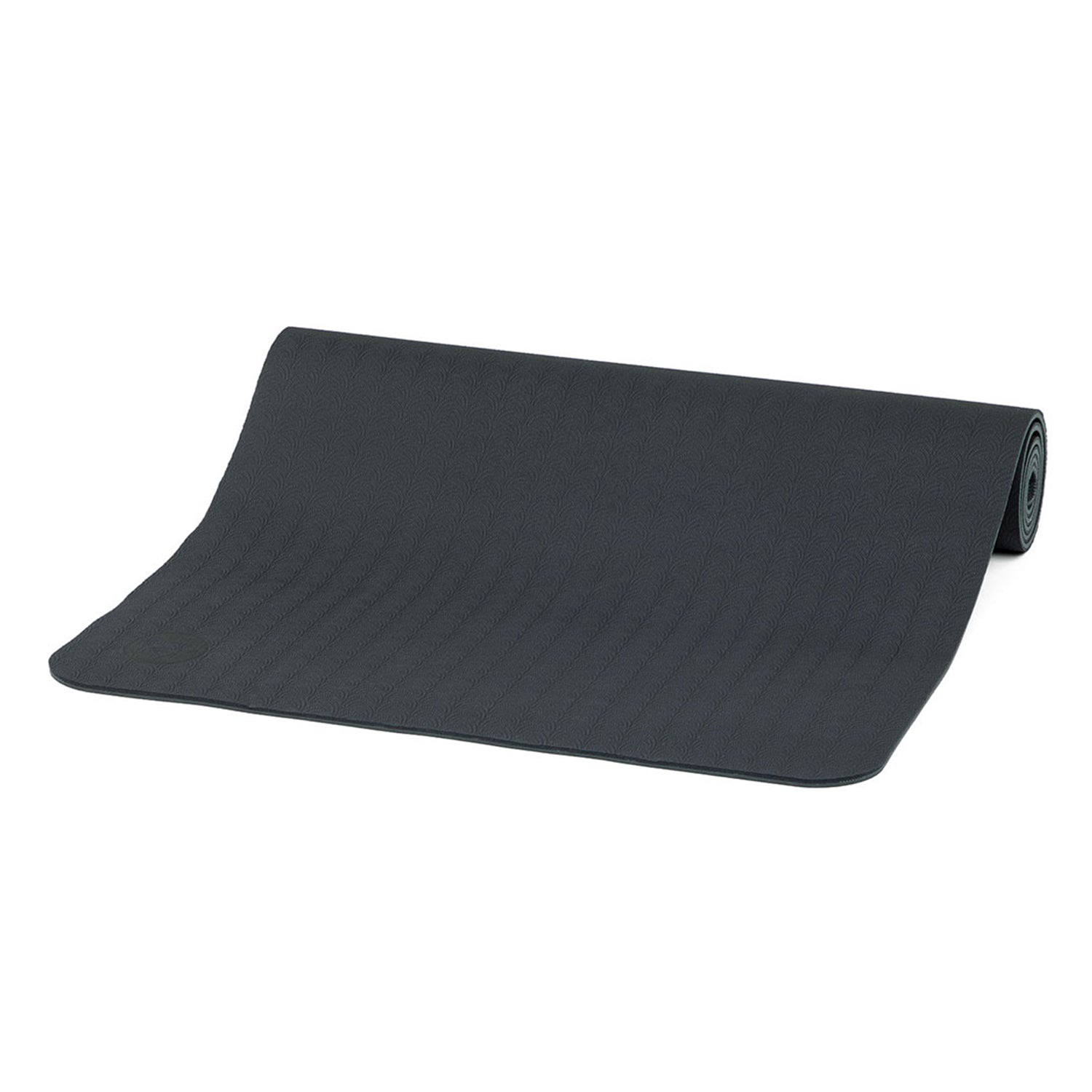 Die teilweise ausgerollte Yogamatte LOTUS PRO in Dunkelgrau aus TPE mit strukturierter Oberfläche ist auf schlichtem weißem Hintergrund zu sehen. Diese umweltfreundliche Matte bietet Funktionalität und Nachhaltigkeit für ein optimales Yoga-Erlebnis.