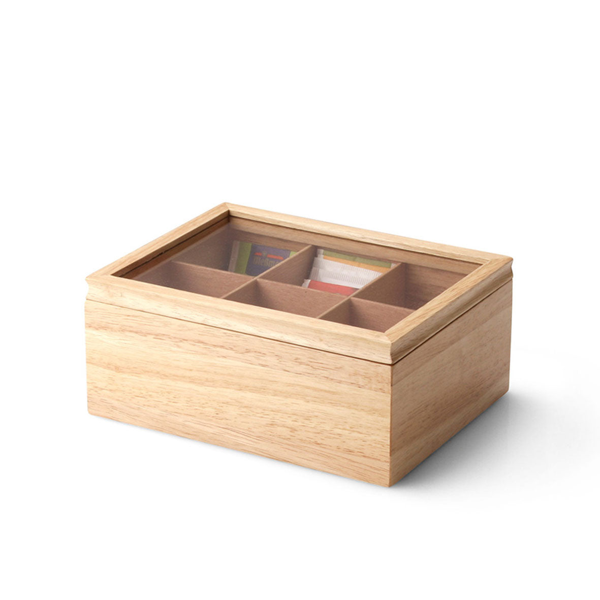 Die Teebeutelbox ist eine leichte Teeaufbewahrungsbox aus Holz mit transparentem Deckel, der vier Fächer freigibt. Jedes Fach enthält eine Auswahl farbenfroher Teebeutel, die die Schönheit und Reinheit jeder Mischung hervorheben.